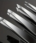 Close-up of four stainless steel tweezers, slant and pointed tips, Eyebrow Tweezers Set For Precision Hair Removal And Facial Grooming
