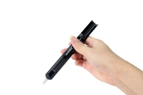 Hand holding Anti-Static Solder Sucker Desoldering Pump with high suction, Teflon tip, ESD safe, for PCB work