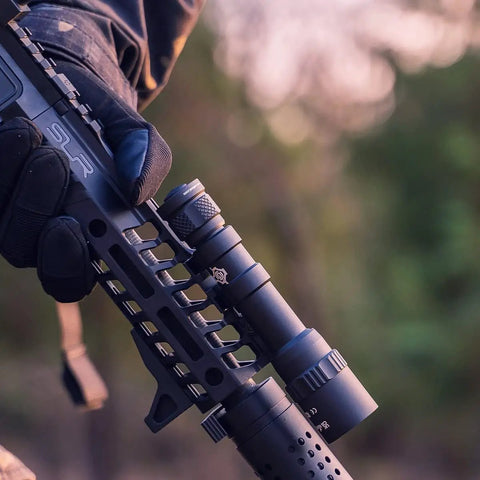 Person holding rifle with LH8 V2 Weapon Light Head Potted 5700K, 128000 CD, 1650 LM, Long Throw 782.38 Yards For W65 and W35 Bodies