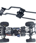 Beefy Carbon Fiber RC Chassis Frame Upgrade Kit for one tenth scale crawlers shown mounted with wheels and drivetrain components.