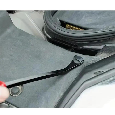 Using a tool to remove a fastener from the 190 Piece Car Plastic Bumper Clip Kit With 6 Styles Retainer Fasteners And Push Rivets