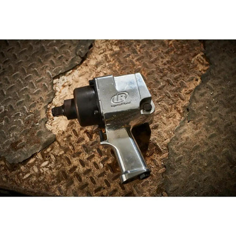 Badass 3/4 Inch Drive Air Impact Wrench Delivering Straight Up 1100 Ft Lbs Max Torque on a textured surface, showcasing its durable design.