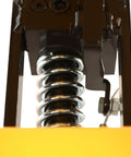 Close-up of hydraulic mechanism and spring on Heavy Duty 500 Lbs Hydraulic Lift Cart With Single Scissor Table Top Lifter And Universal Wheels Plus Rack For Freestanding Workshop Garage Material Handling.