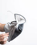 EYESHAKER microfiber glasses cleaning cloth, gray, close-up with eyeglass frame
