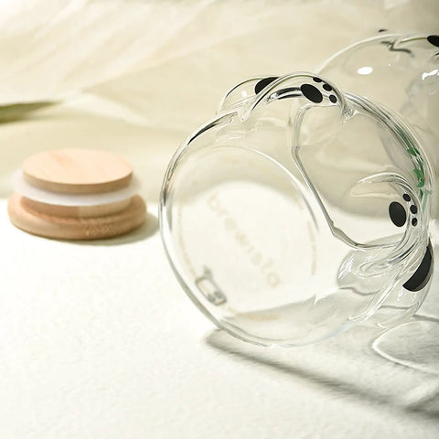 Airtight Glass Coffee Bean Jar With Fun Panda Lid Keeps Whole Beans And Grounds Locked In Heat Resistant Transparent Tea Sugar Canister Top Shelf Fresh Storage For Coffee Crew showing panda lid detail.