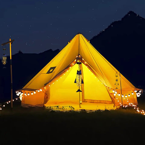 Handcrafted Iron Fish Lantern With Solar Powered Warm White LED Lights hanging in illuminated tent, outdoor night scene.
