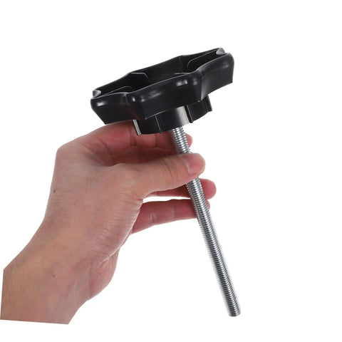 Hand holding spare tire hold down bolt replacement hardware for vehicles universal fitment easy to install spare wheel mounting bolt and hardware