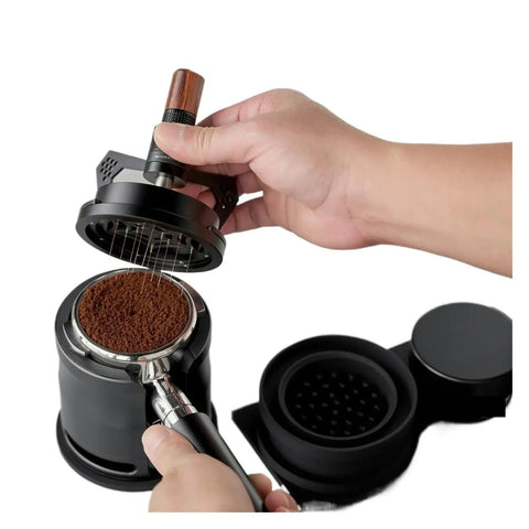 Image of Snag This Knockout Espresso Coffee Tool Set For A Locked In Perfect Pull Featuring A Quick Rotary Wdt Dispenser Solid Wood V3 Tamper And Flat Leveler To Break Up Clumps Like A Pro Daily, with a hand using the rotary WDT tool on fine coffee grounds.