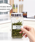 Hand holding jar with Freezer Labels 375 Pcs Self Adhesive Write On Removable 3 Rolls No Fuss 3x1 Inch Tape For Containers