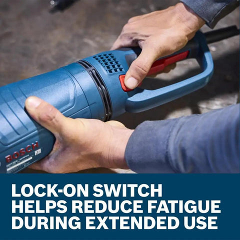 Hands handling GWS25-230JR 9 Inch Large Angle Grinder showing lock-on switch feature.