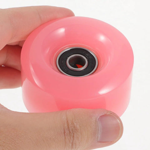 Close-up of a pink semi-jelly roller skate wheel with bearing, part of the Double Row Roller Skate Wheels With Bearings 4 Pack.