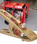 500A Welding Ground Clamp Copper Grip Brass A Shape Earth Clamp for MIG TIG ARC Welding Machines with red generator backdrop