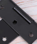 Close-up of Badass Heavy Duty Iron Barn Door Hinges With Screws, 2 To 8 In Steel Pivot Plates for rustic gates.