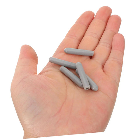Huge Pack Of Dishwasher Rack End Caps And Tine Protectors Featuring A Hell Of An Easy Snap Installation For Modern Kitchens Solid Heavy Duty Replacement Parts That Really Fix Peeling Or Snapped Pegs In A Jiffy, gray end caps on a hand.