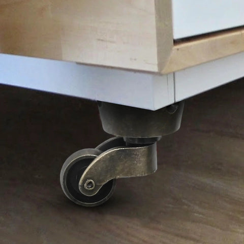 Installed two pack vintage zinc alloy swivel caster wheels with antique green bronze finish under furniture piece