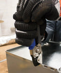 Worker using Punch Set Snap Lock Handy Tool For Sheet Metal, Vinyl And Aluminum Siding, Creates Three Eighths Inch Impressions.