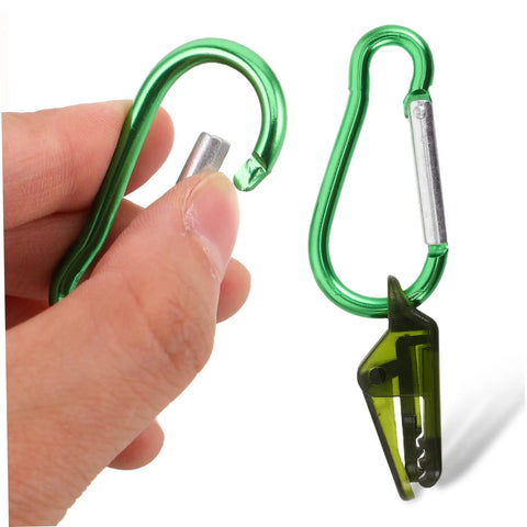 Person holding green Heavy Duty Tarp Clips And Tent Clamps Weatherproof Plastic For Lock Tight Fastening Of Awnings, Canopies, And Outdoor Gear.