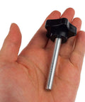 Kasteco M8 x 60mm star hand knob with black knob and silver threaded stud, held in hand
