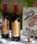 Premium Heat Shrink Wine Bottle Caps 100 Pack Flexible PVC Sealing Film on red-capped wine bottles with glass of red wine.