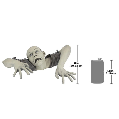 Creepy zombie statue emerging from ground, detailed hands and face. Zombie Of Montclaire Moors Indoor Outdoor Garden Statue Halloween Decor.