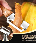 Close-up of Two Pack 2 In 1 Veggie Peeler And Bottle Opener With Stainless Steel Blade and Wooden Handle peeling a vegetable
