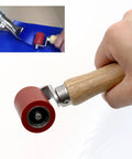 Tylulikaty 40mm silicone seam roller with wooden handle and red wheel.