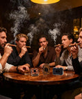 Group of men smoking cigars with Guillotine Premium Cigar Cutter 23Mm Max Stainless Steel Sharp Double Blade For Clean Fast Cuts Blue Finish Cigar Scissors on table