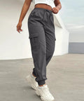 Woman wearing Women Lightweight Quick Dry Cargo Hiking Pants With High Waist Fit All Day Comfort Stretchy Parachute Style Baggy Travel Joggers For Camping Fishing Running Gym And Outdoor Adventures.