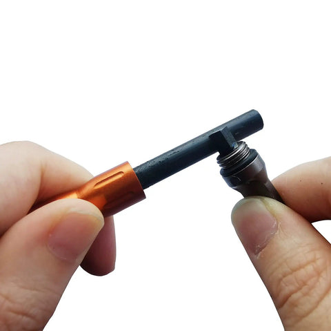 Hands assembling Three Pack Ferro Rod Fire Starters With Scraper Striker, Compact Weatherproof Survival Flint Sticks