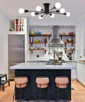 Eight Light Black Sputnik Ceiling Fixture For Kitchen And Dining Rooms installed above kitchen island with barstools