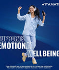 Person wearing headphones and holding a phone, with text "Supports Emotional Wellbeing" on a blue background, Vitamatic logo.
