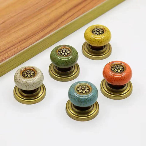 Super Cool Yellow Leopard Ceramic Cabinet Knobs 5 Pack Groovy Petal Cupboard Pulls With Rustic Zinc Backplate Smart Diy Install For Kitchen Drawers Wardrobe Door Decor Vibe, multi-colored knobs with brass bases.