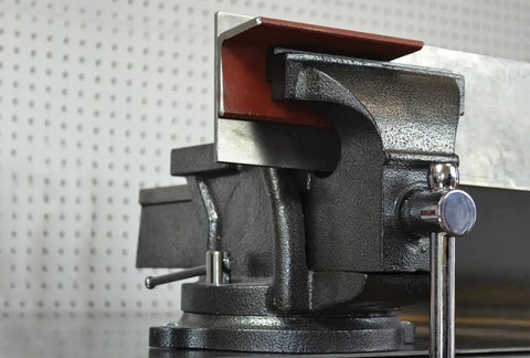 Close-up of Heavy Duty 6 Inch Bench Vise With 36 Degree Swivel Base Hardened Serrated Jaws Built In Anvil And 6 Inch Jaw Opening