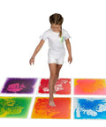 Child stepping on 12 Inch Multi Colored Liquid Tiles 6 Pack For Playrooms And Classrooms Interactive Gel Floor Tiles That Move With Every Step
