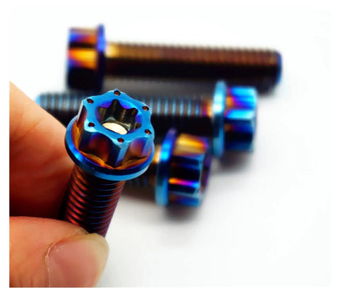 Top Shelf Grade 5 M8 Titanium Screws 4 Pack Burning Blue Torx Flange Head Bolts in hand, showcasing burnished blue finish.