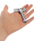 Rock-Solid Alloy Trailer Locking Pin With Long Screw For Secure Hitch Connector held in hand, showing heavy-duty T-shaped fastener.