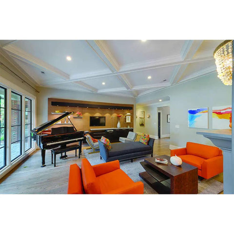 Upgrade Recessed Lighting With A Six Pack Of Indoor Outdoor LED Retrofit Trim Can Lights illuminating a modern living room.