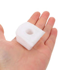 Hand holding a white toe stop block for roller skates, designed for quick, easy install and safer skating for kids and beginners.
