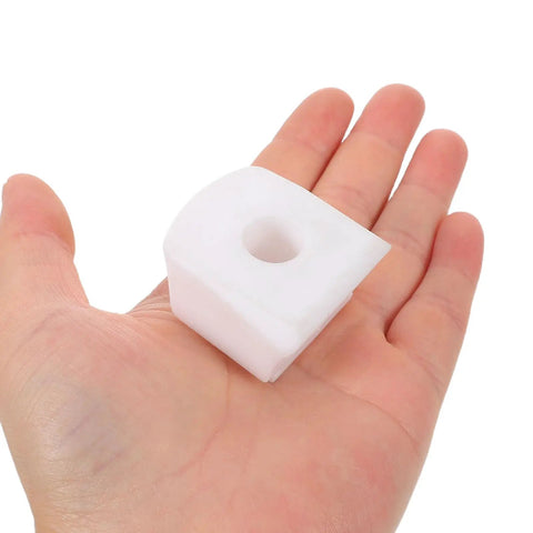 Hand holding a white toe stop block for roller skates, designed for quick, easy install and safer skating for kids and beginners.