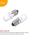 Close-up of Built Tough E10 Screw Base Led Bulb 12 Vdc 0.25 Watt White Round Top Mini Lamp, showing two bulbs with metal bases.