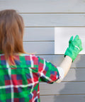 Person applying Vinyl Siding Repair Patch Kit 6x8 Inch Self Adhesive PVC Tape Hole Cover For Mobile Homes Skirting Fences.