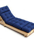 Blue all-weather outdoor lounge chair cushion with ties on wooden frame; 74.4x22x4.7 inches, waterproof and quick rebound.