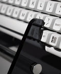 Transparent Acrylic Keyboard Display Stand For Up To Three Keyboards showcasing white keyboards on clear holder, side angle