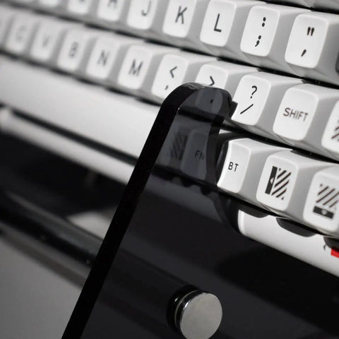 Transparent Acrylic Keyboard Display Stand For Up To Three Keyboards showcasing white keyboards on clear holder, side angle