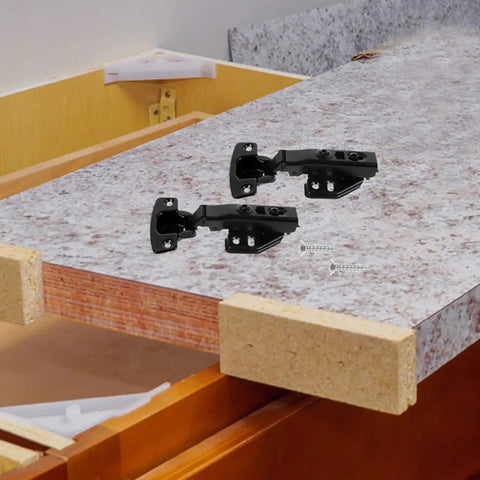 Concealed Black Stainless Steel Cabinet Hinges Set Of 3 With Full Overlay Design And No Slam Soft Close on countertop