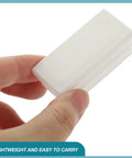 Hand holding a piece from 20 Pcs White Plastic Hole Plugs For Square Tubing Furniture Leg End Caps Glide Caps No Slip Chair And Table Protection Easy Slip On And Off Durable DIY Furniture Refresh set.
