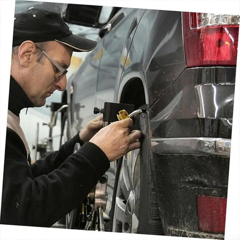 Mechanic using Heavy Duty 124-Piece 304 Stainless Steel Threaded Insert Kit With Cutting Slots on car wheel for secure installation