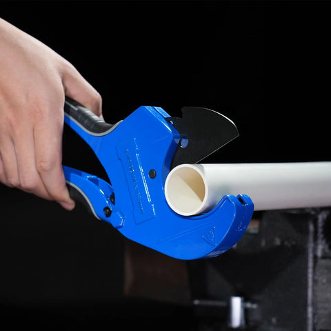 Pacmann blue PVC pipe cutter cutting a white PVC pipe up to 2-1/2 in with ratchet blade