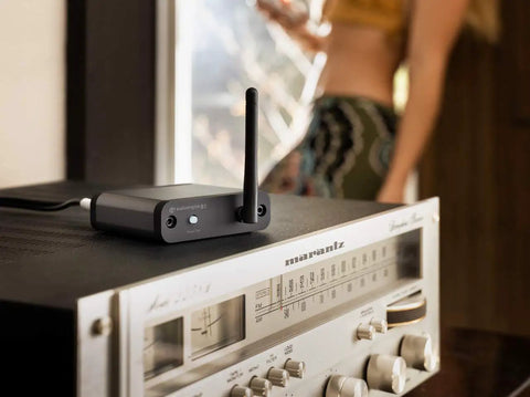 32 Bit Bluetooth Receiver For Home Stereo With Adaptive Bluetooth 5.3, Optical And RCA Outputs placed on vintage amp