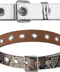 Two belts featuring metal grommets, one white leather and one snake print, showcasing the All-In-One One-Eighth Inch Metal Grommets And Eyelets Kit.